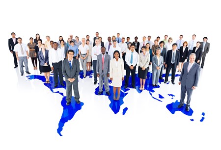 business people stood on world map