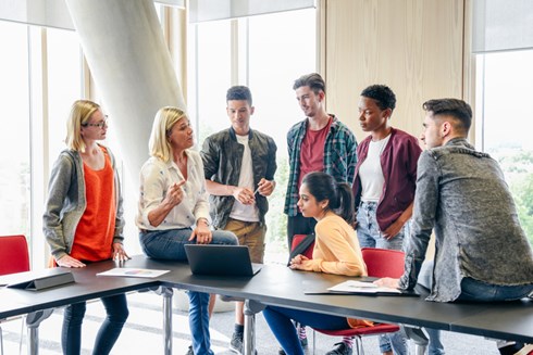 teacher talking to student