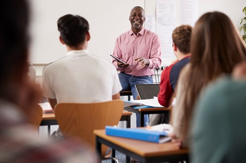 teacher talking to students in class