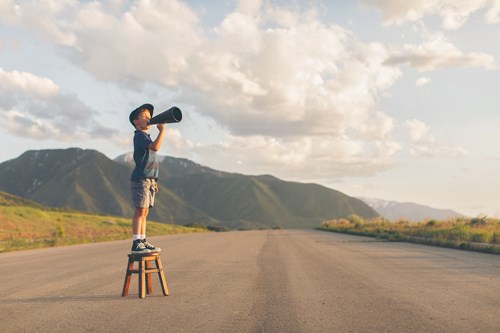 boy on a stool with megaphone