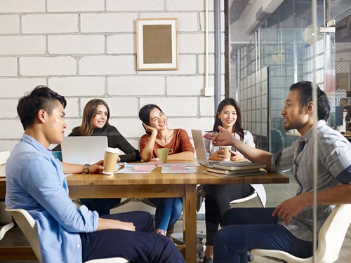 students discussing in cafe