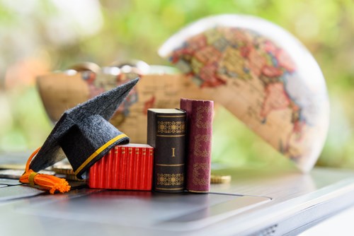 books and graduation hat