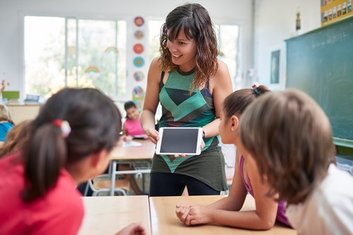 female teacher with tablet